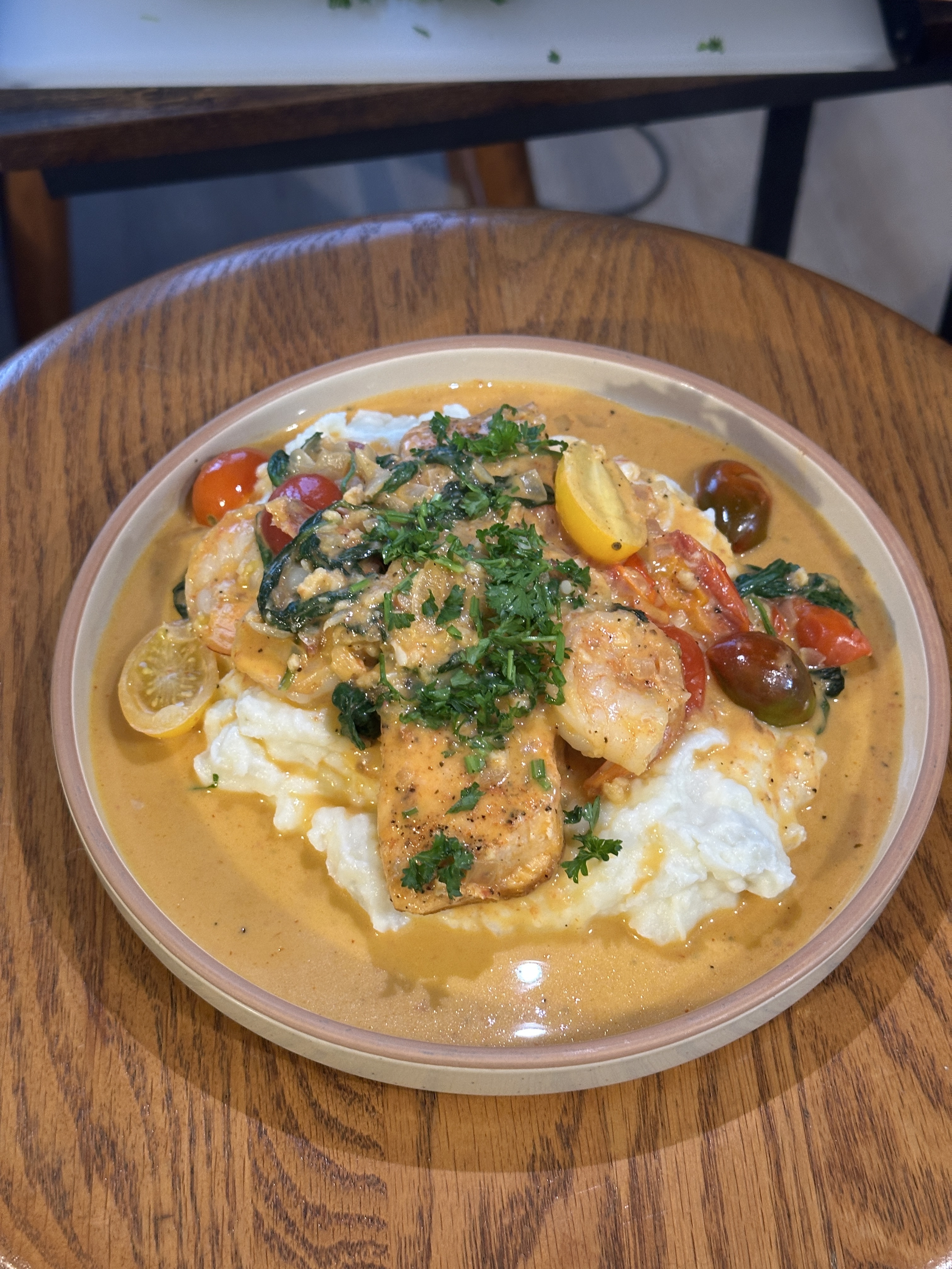 Flavorful, rich, cajun salmon w/ mashed and greens